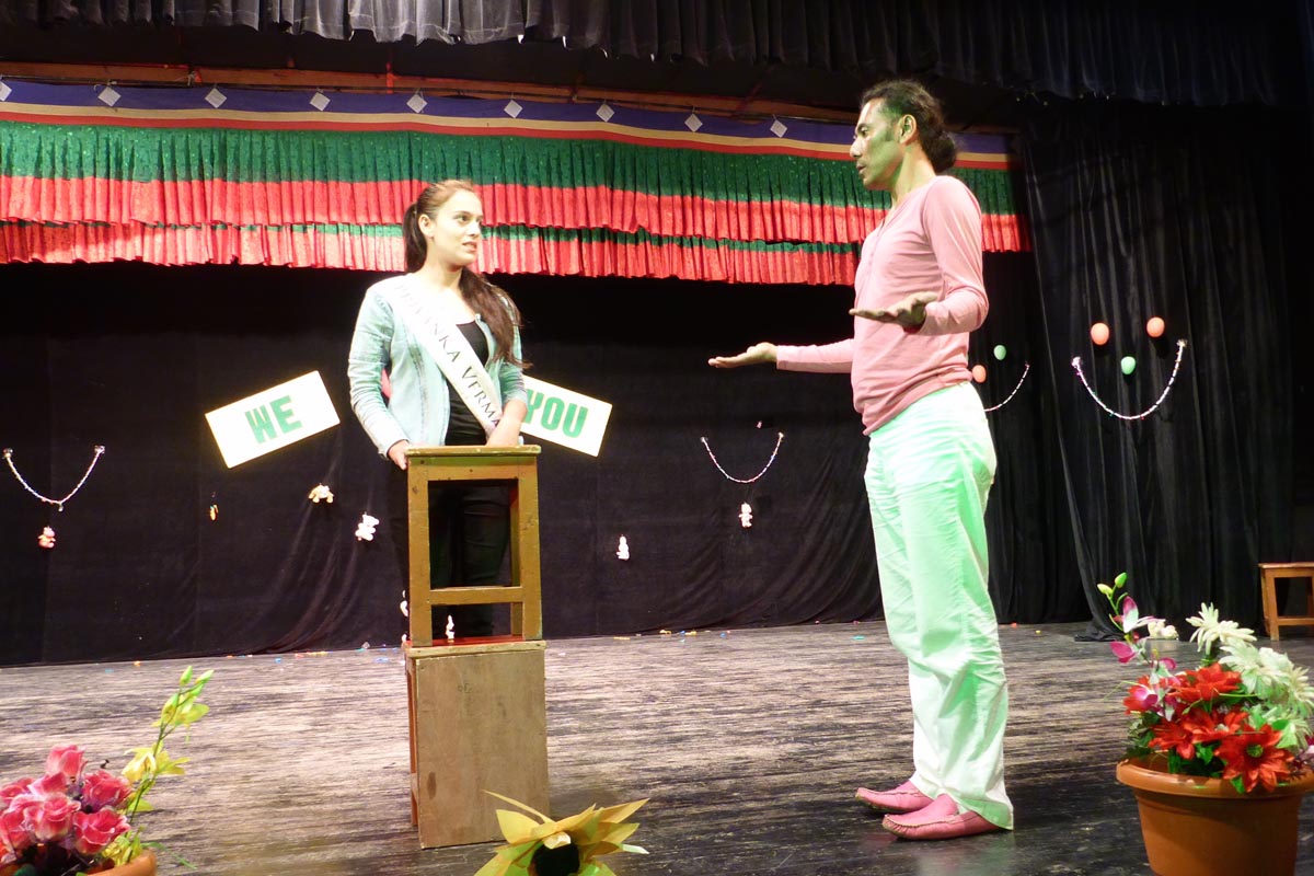 Director talking with contestant Priyanka Verma during rehearsal.