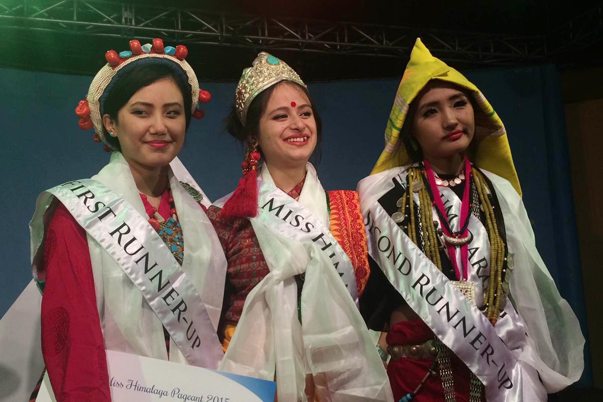 Winner of the Miss Himalaya Pageant 2015 Tanshuman Gurung, First Runner-up Tenzing Sangnyi, and Second Runner-up Chum Darang pose for a photo after the coronation ceremony at TIPA in McLeod Ganj, India.