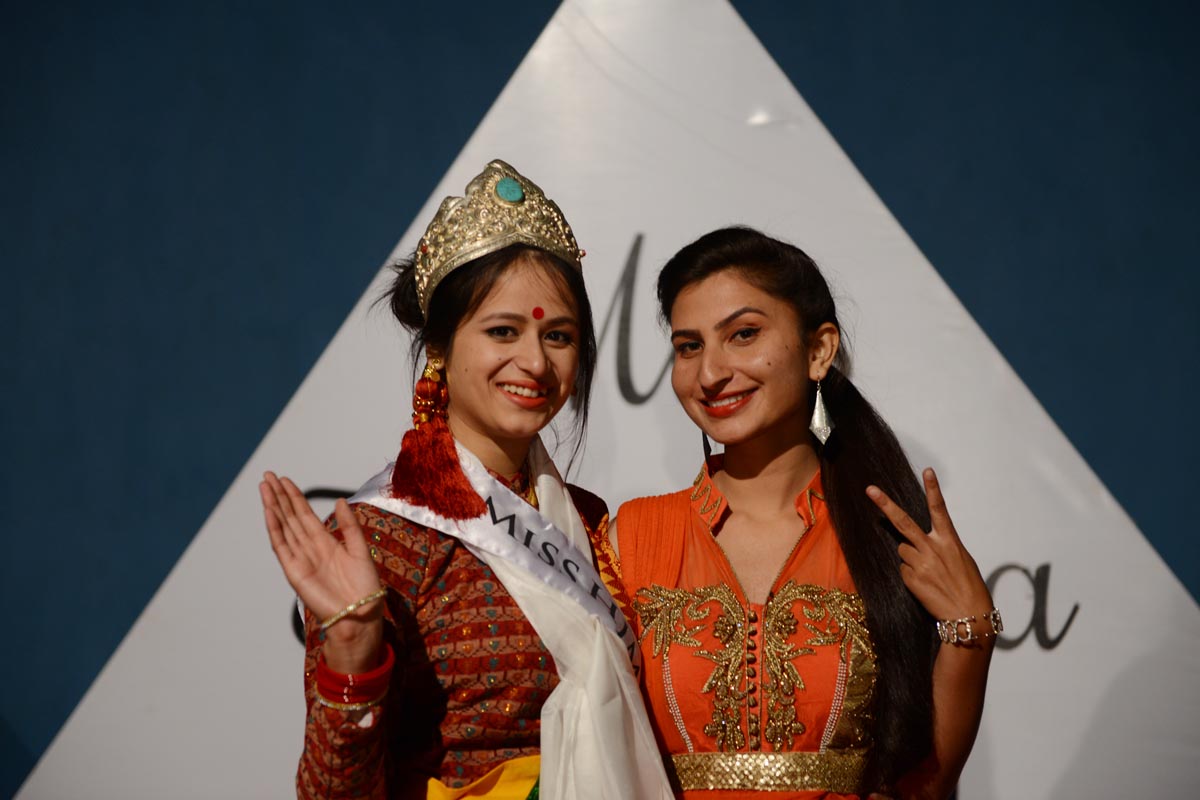 Winner of the Miss Himalaya Pageant 2015, Tanshuman Gurung, and former Miss Himalaya Jyoti Dogra, pose for a photo after the coronation ceremony at TIPA in McLeod Ganj, India.