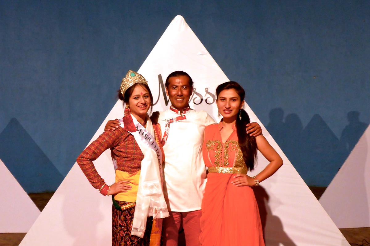 Winner of the Miss Himalaya Pageant 2015, Tanshuman Gurung, Director of the Pageant, Lobsang Wangyal, and former Miss Himalaya, Jyoti Dogra, pose for a photo after the coronation ceremony at TIPA in McLeod Ganj, India.
